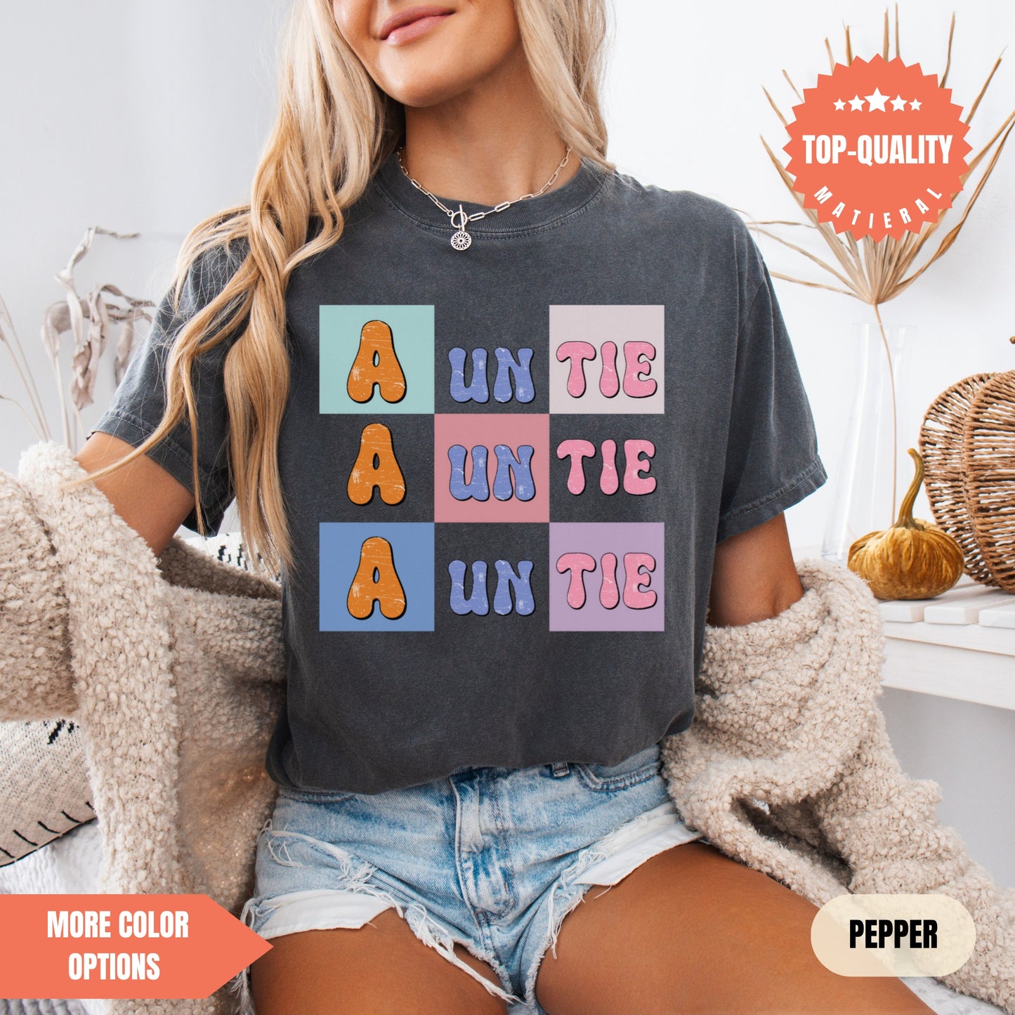 a woman sitting on a bed wearing a t - shirt that says un the a