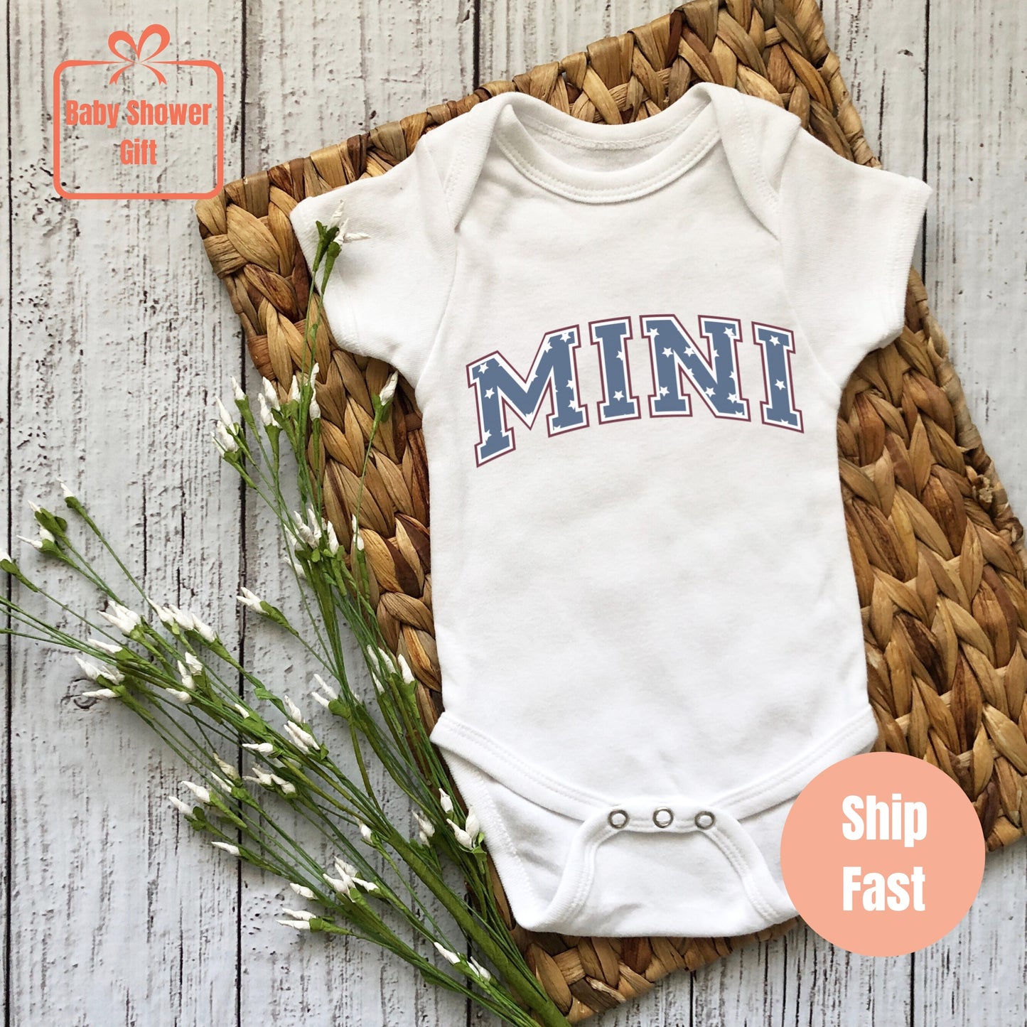 a baby bodysuit with the word mini on it