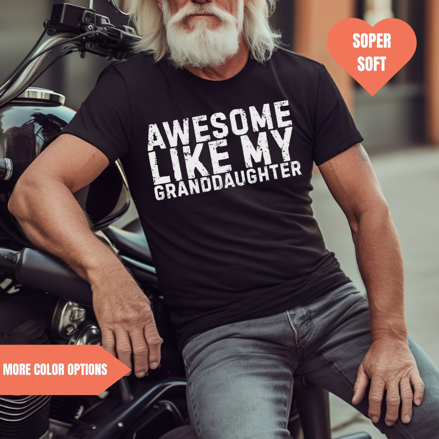 a man sitting on a motorcycle wearing a t - shirt