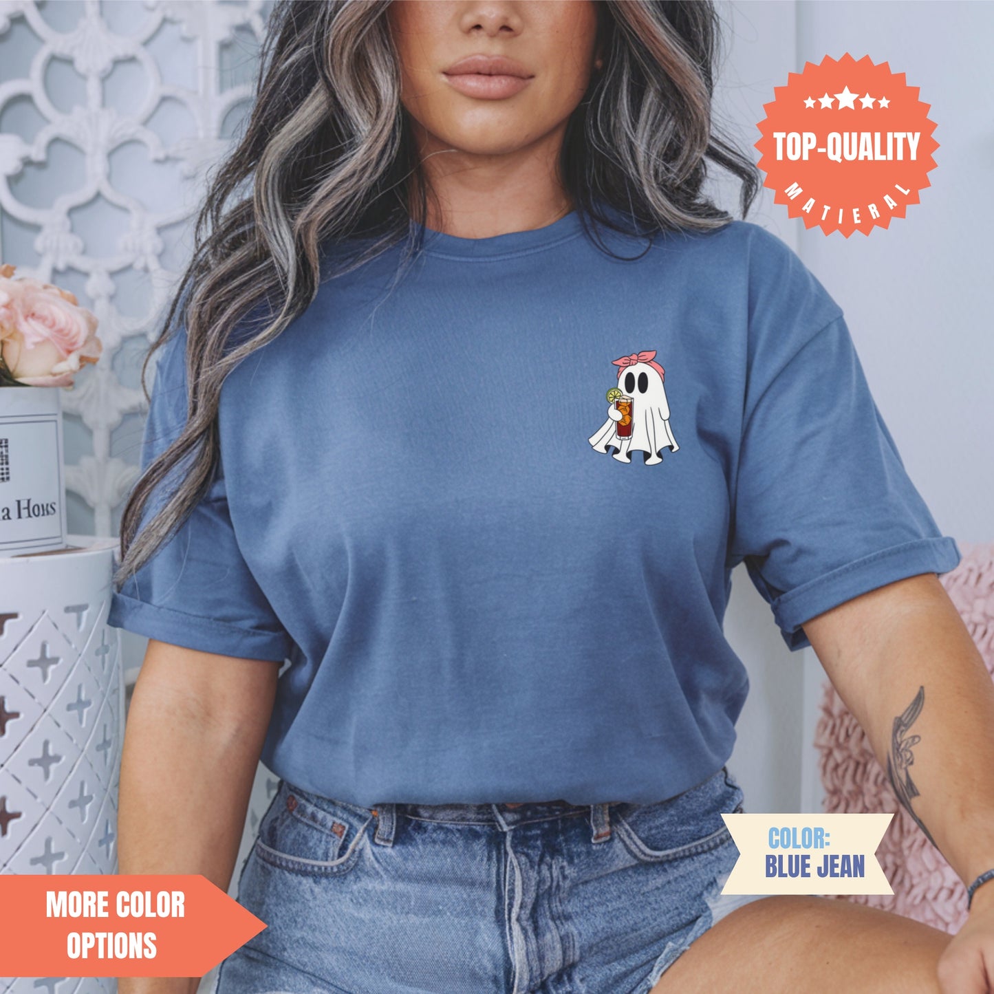 a woman wearing a blue t - shirt with a dog on it
