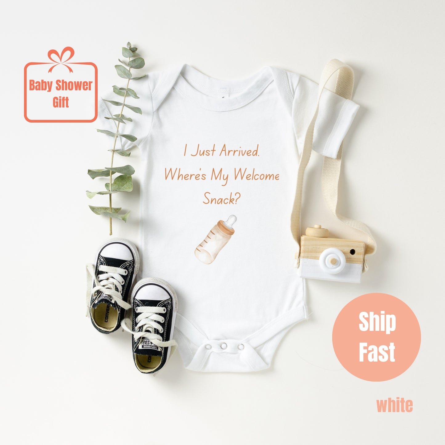 a baby bodysuit with a baby boot and a skateboard
