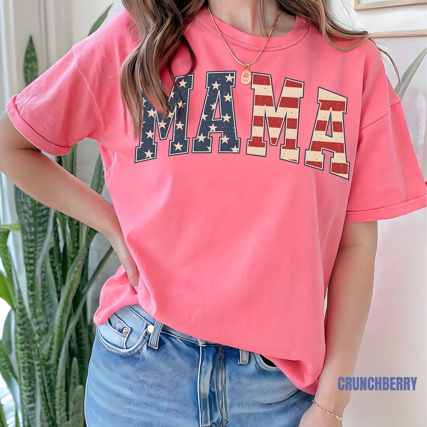 a woman wearing a pink shirt with the word mama on it