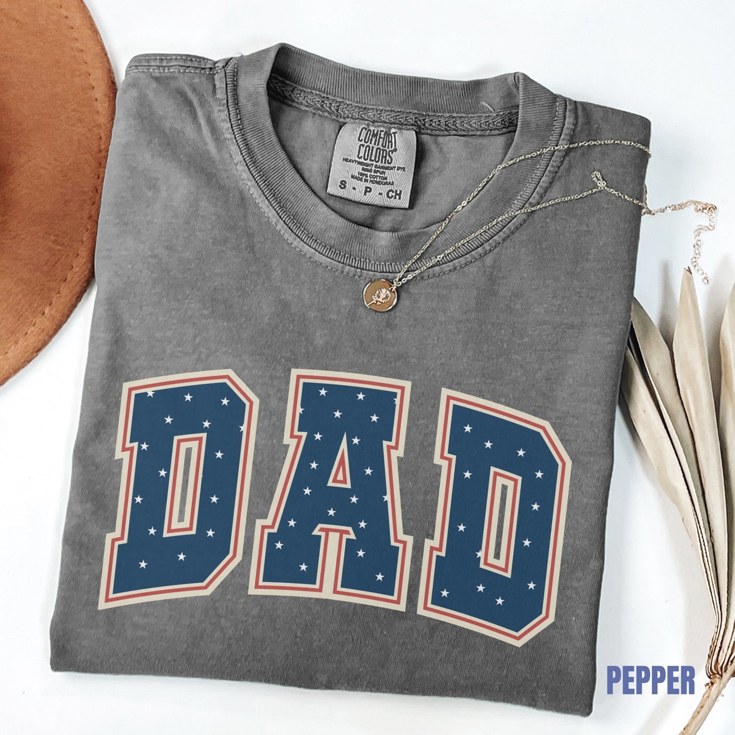 a t - shirt with the word dad on it