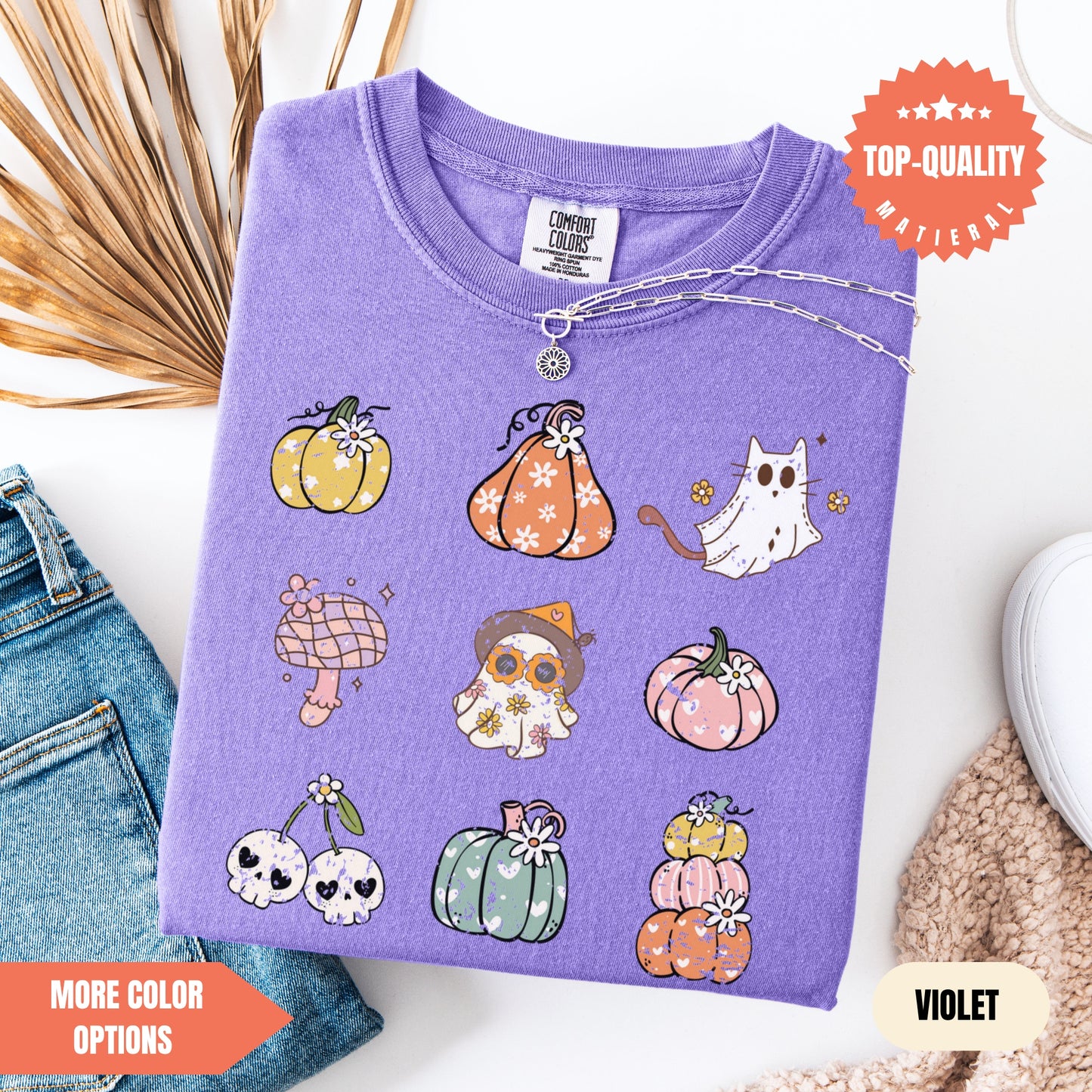 a purple shirt with a bunch of pumpkins on it