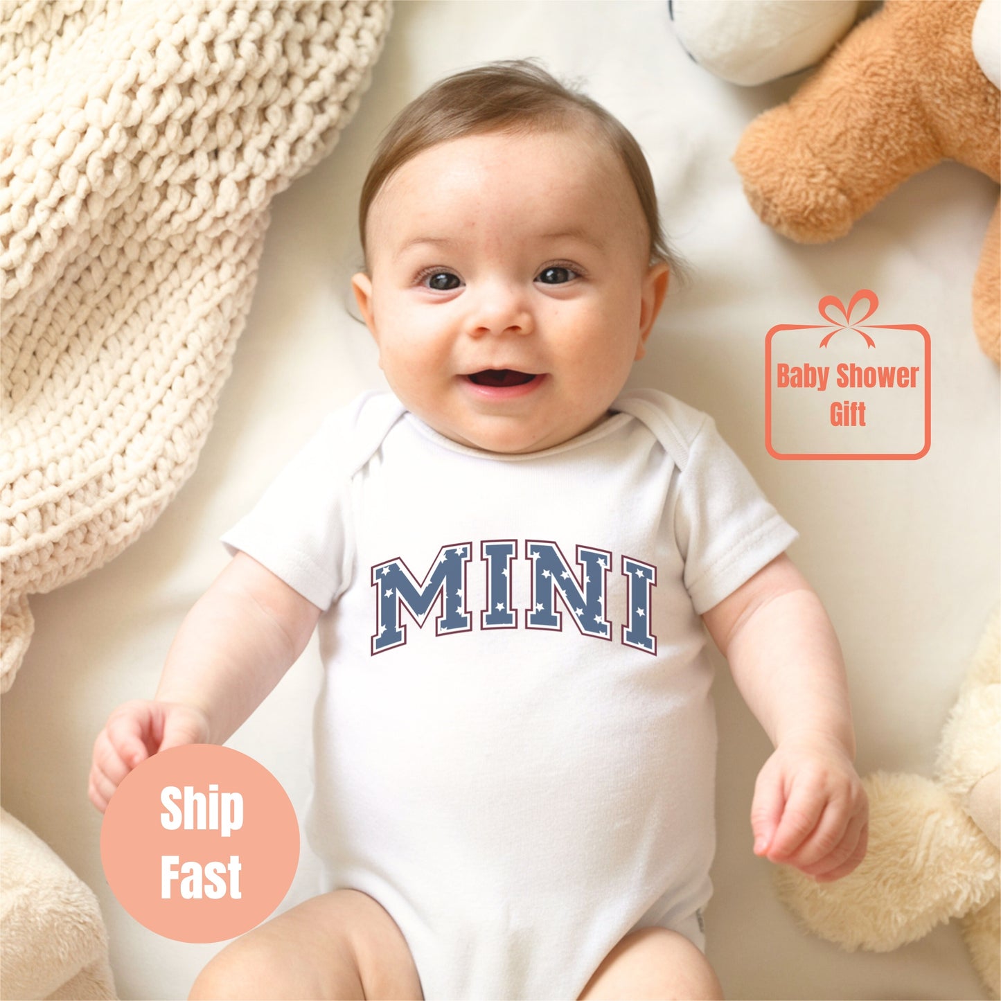 a baby in a bodysuit sitting next to teddy bears