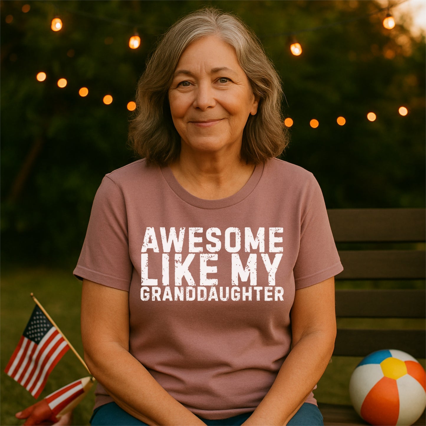 a woman sitting on a bench with an american flag