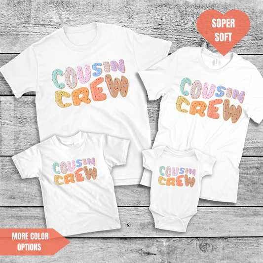 a couple of shirts that are on top of a wooden table