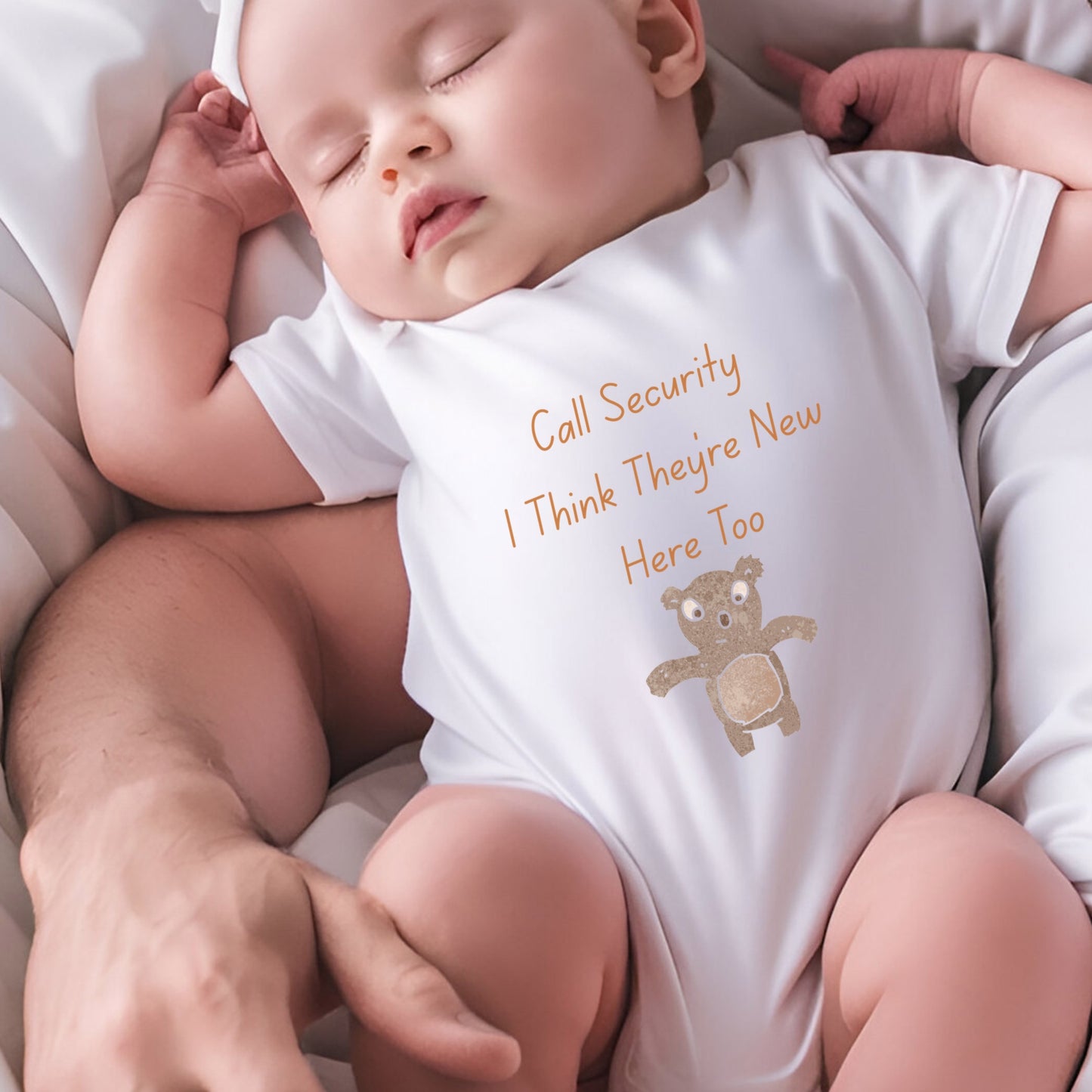 a baby sleeping on a bed with a teddy bear on it
