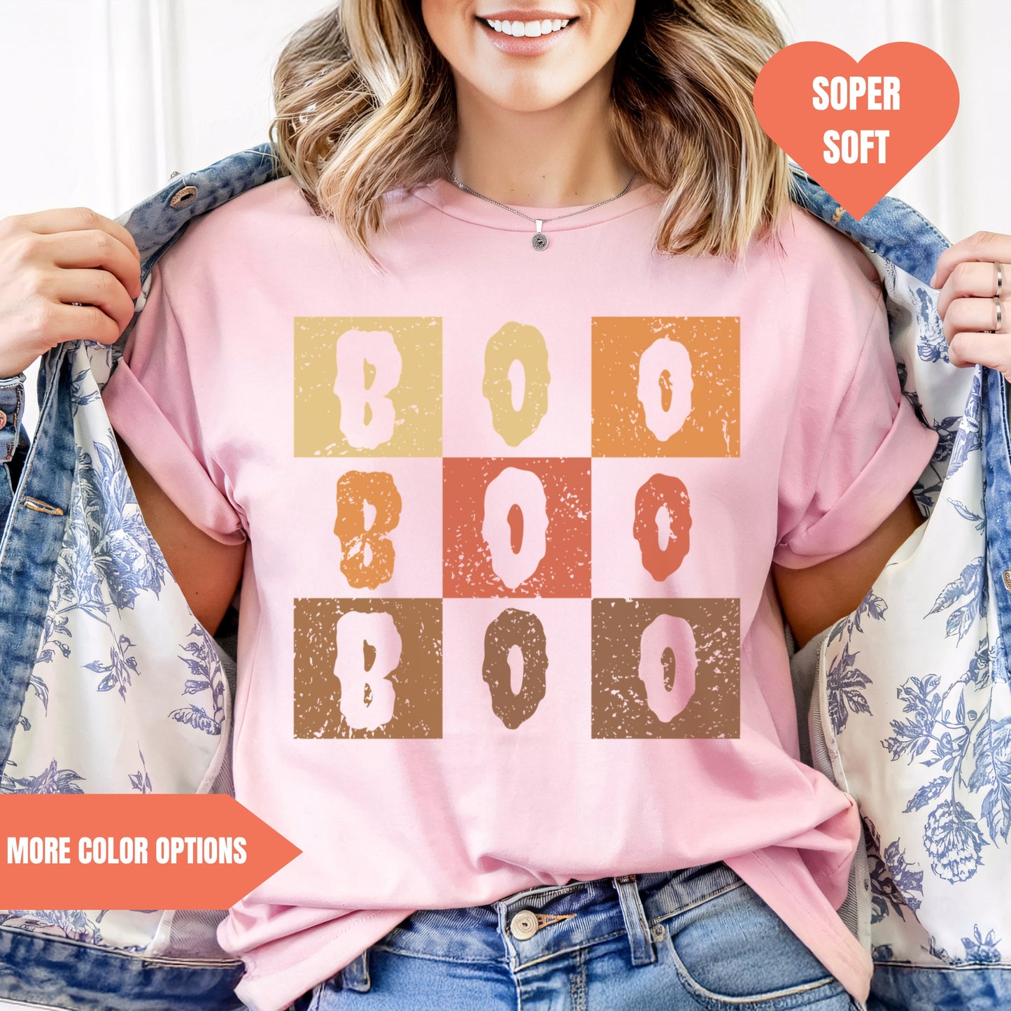 a woman wearing a pink t - shirt with boo boo boo boo boo boo boo