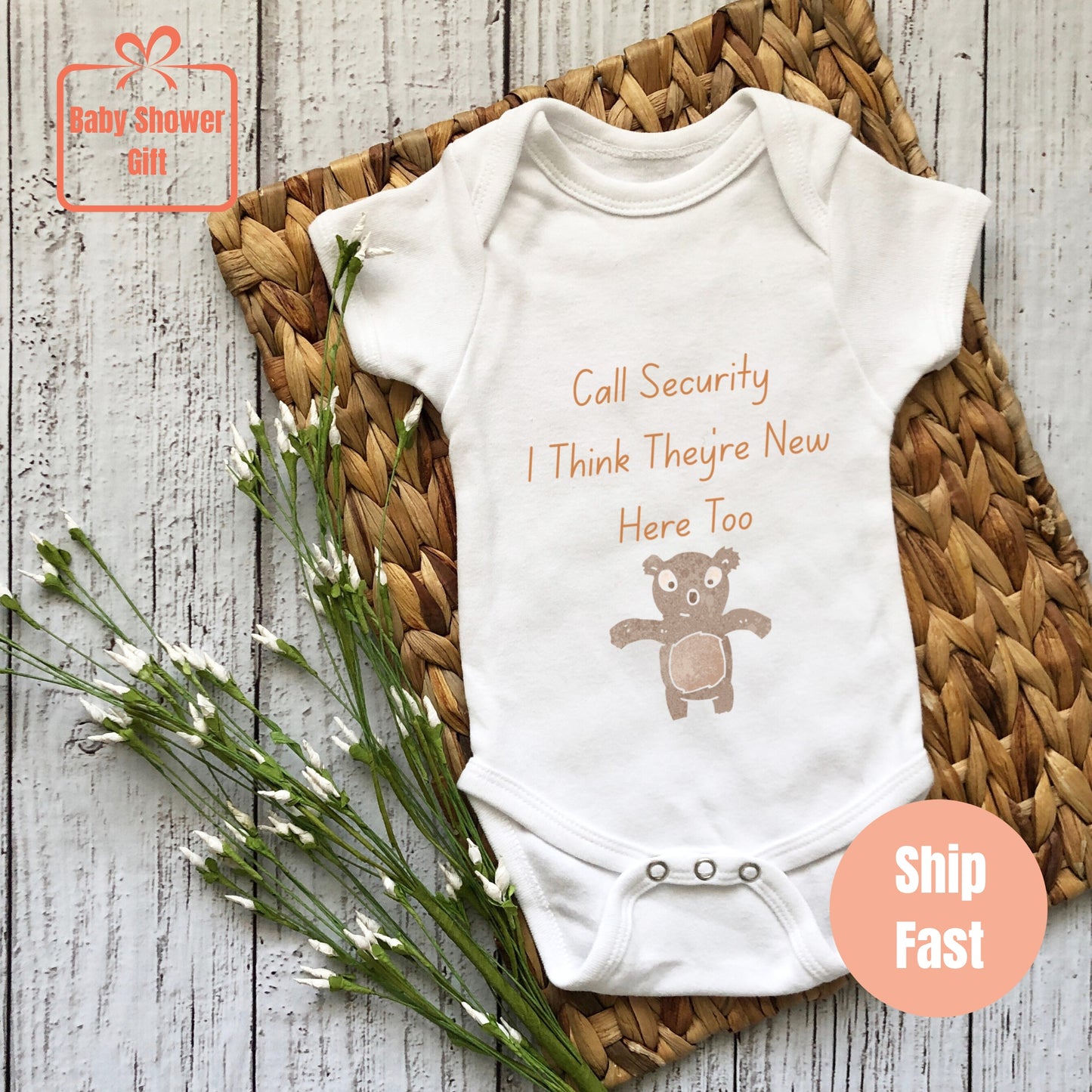 a baby bodysuit with a teddy bear on it