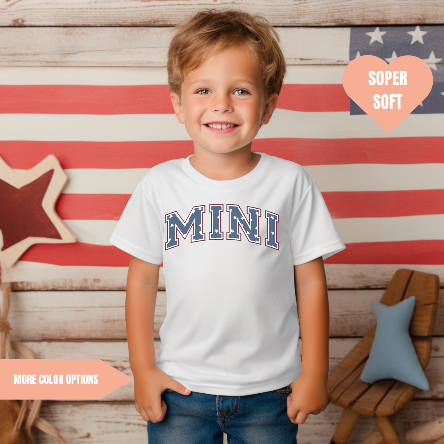 a young boy standing in front of an american flag