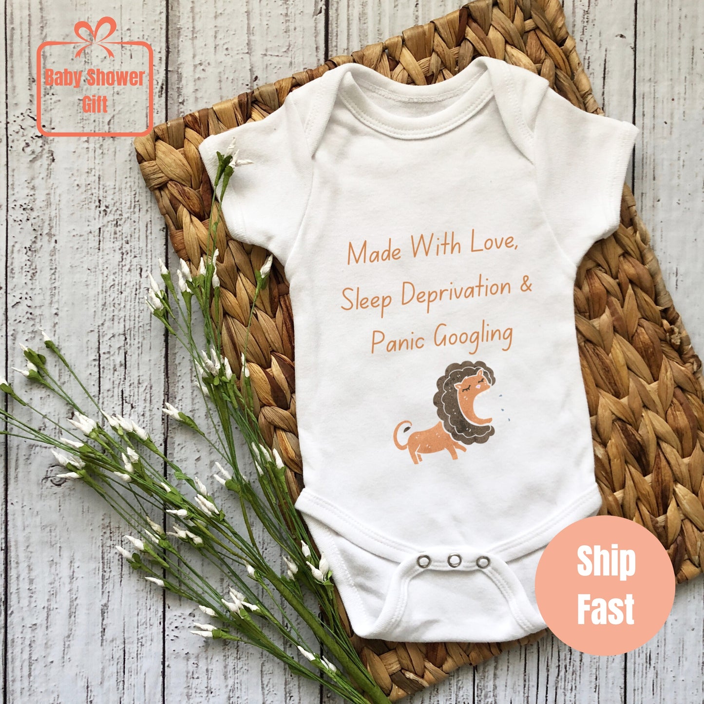 a baby bodysuit with a lion on it