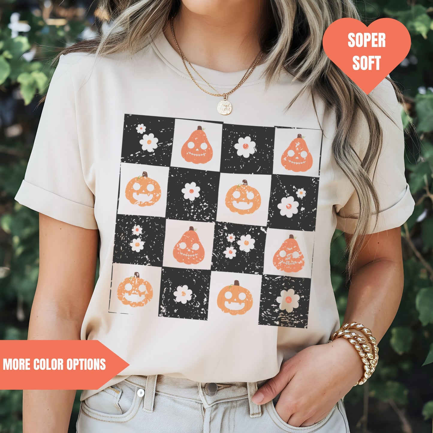 a woman wearing a t - shirt with pumpkins on it