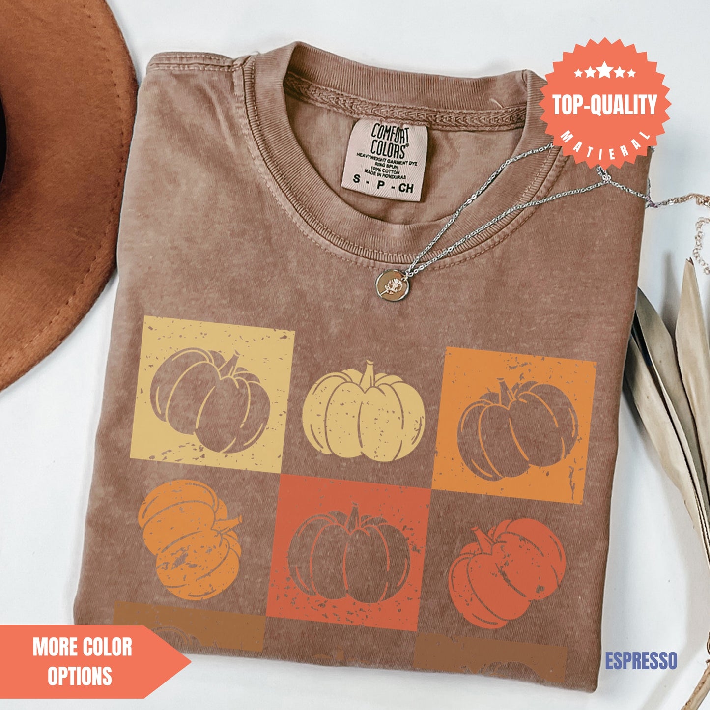 a t - shirt with a picture of pumpkins on it