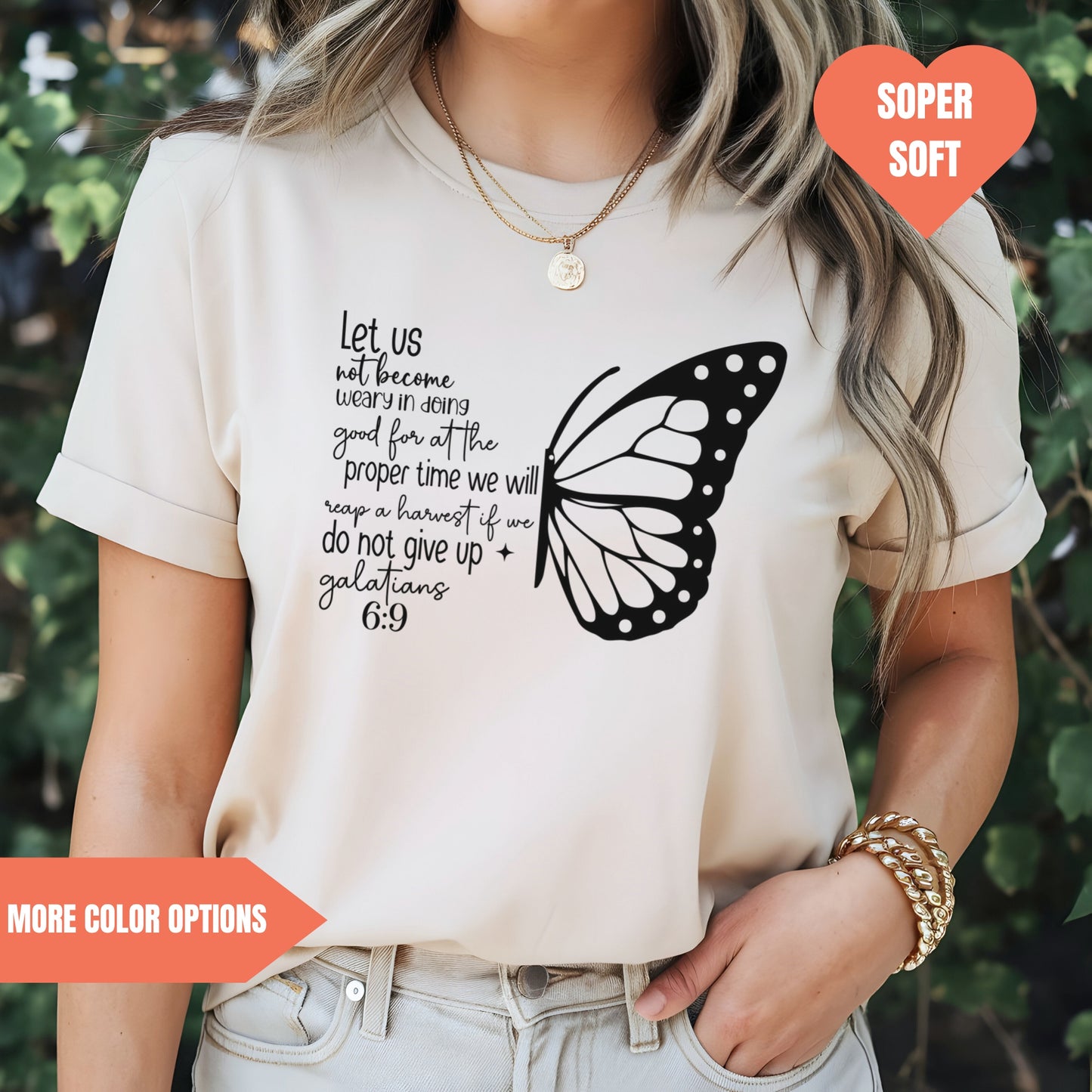 a woman wearing a t - shirt with a butterfly on it