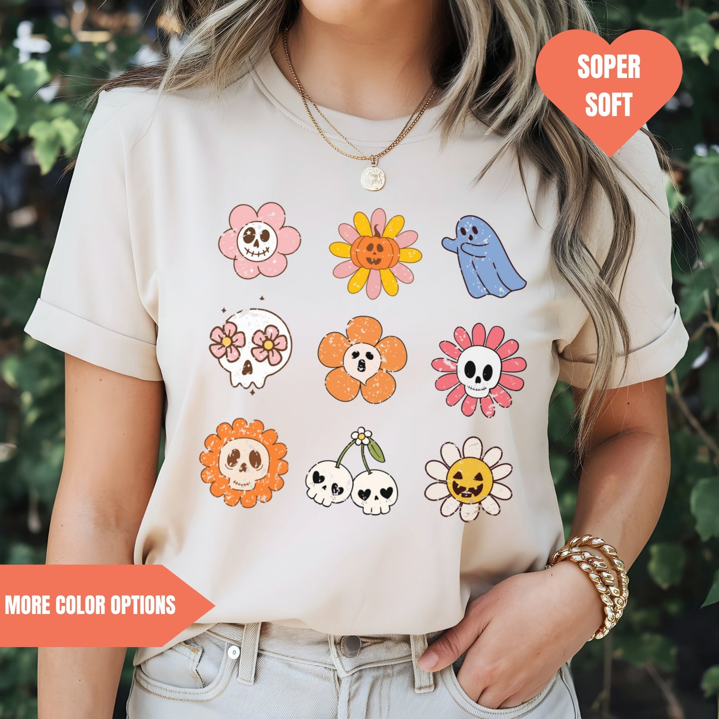 a woman wearing a t - shirt with skulls and flowers on it