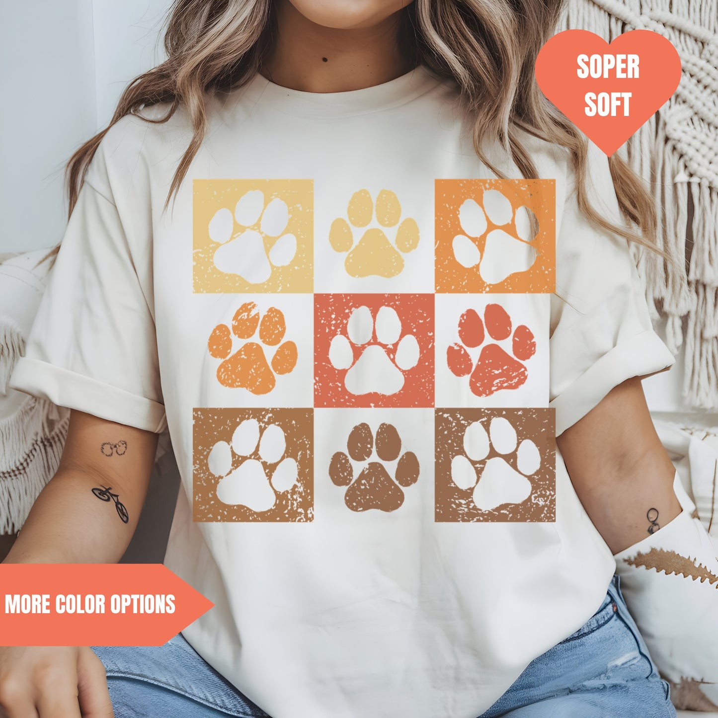 a woman wearing a t - shirt with paw prints on it