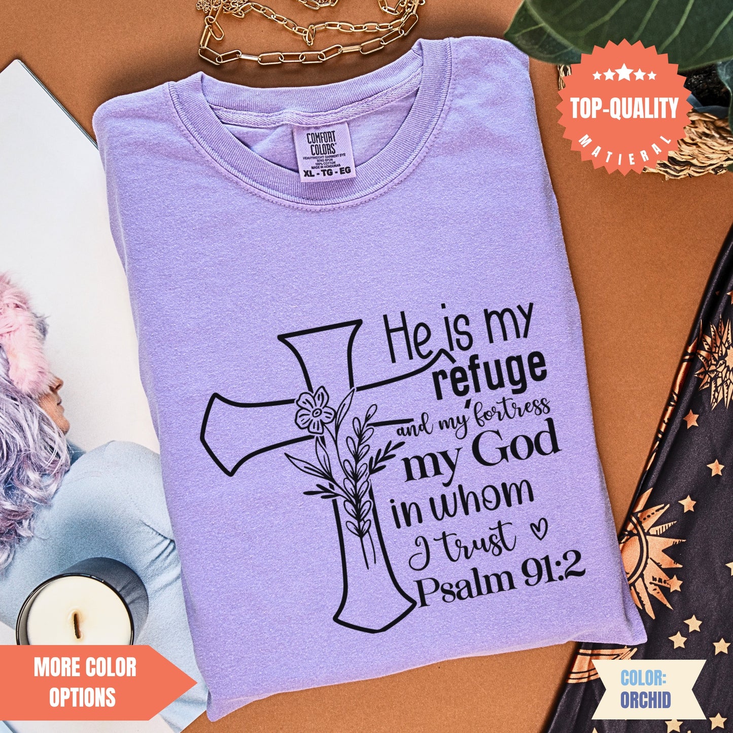 a purple t - shirt with a cross on it