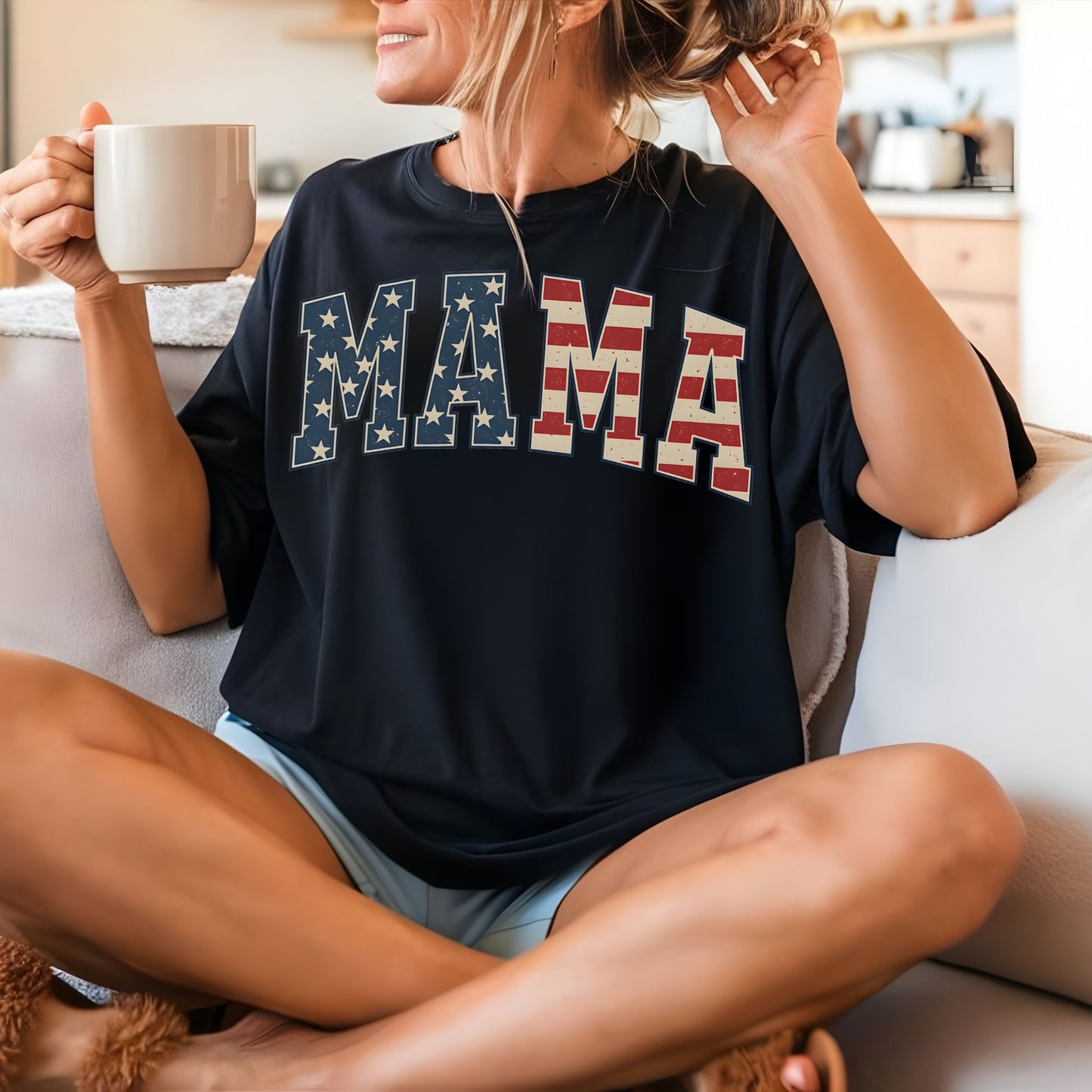 a woman sitting on a couch holding a cup of coffee