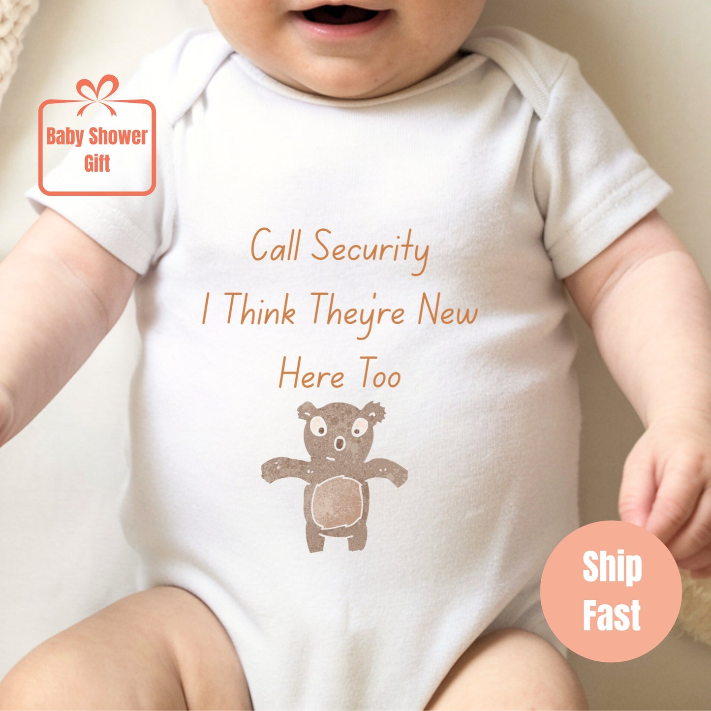 a baby wearing a bodysuit with a teddy bear on it