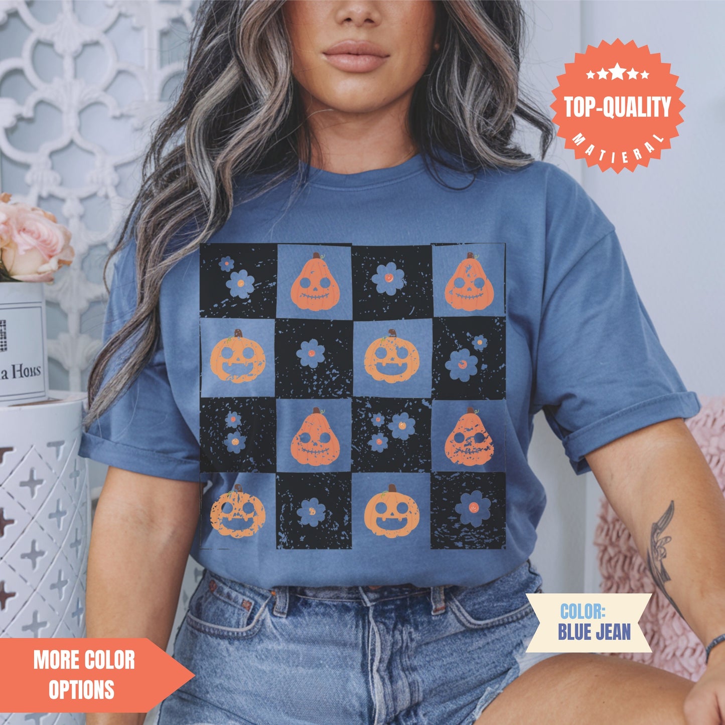 a woman wearing a t - shirt with pumpkins on it