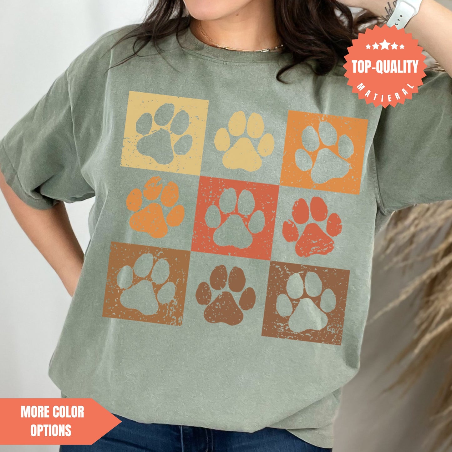 a woman wearing a t - shirt with paw prints on it