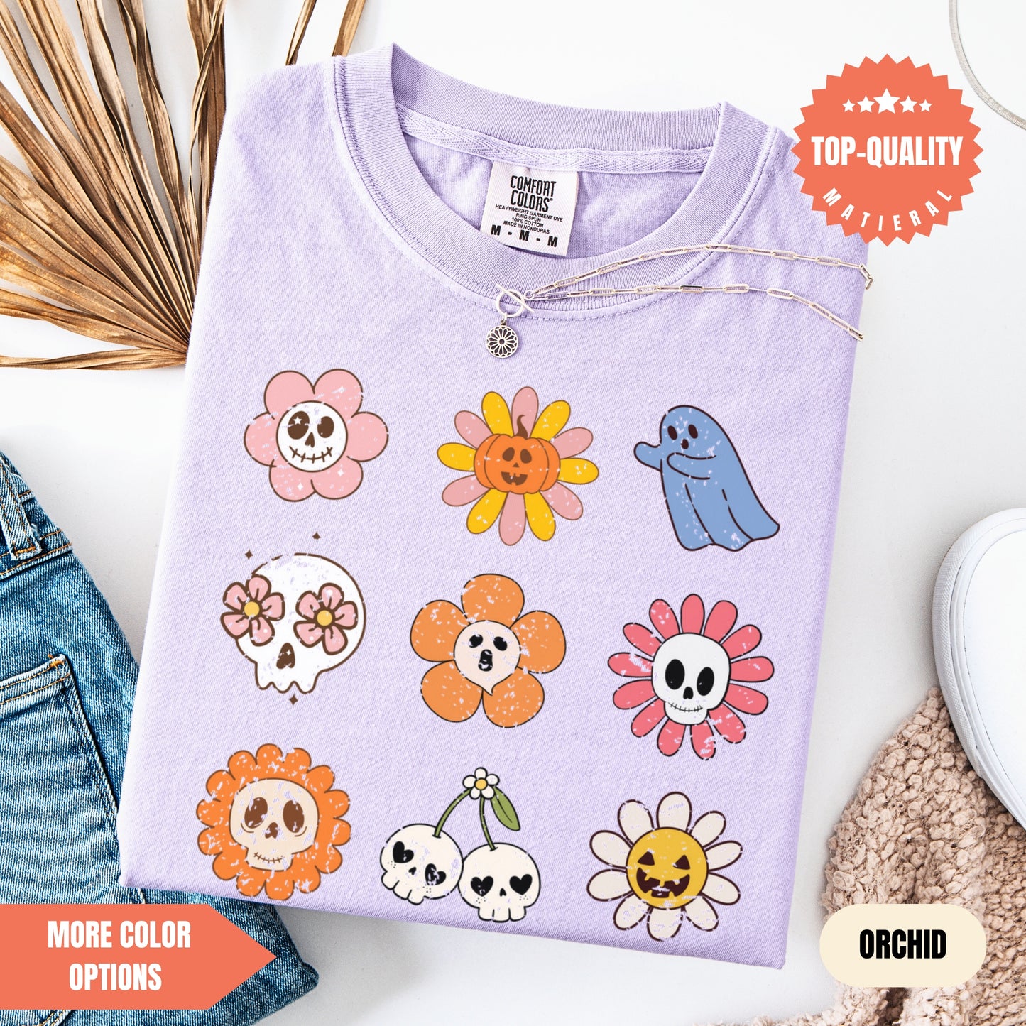 a purple shirt with skulls and flowers on it