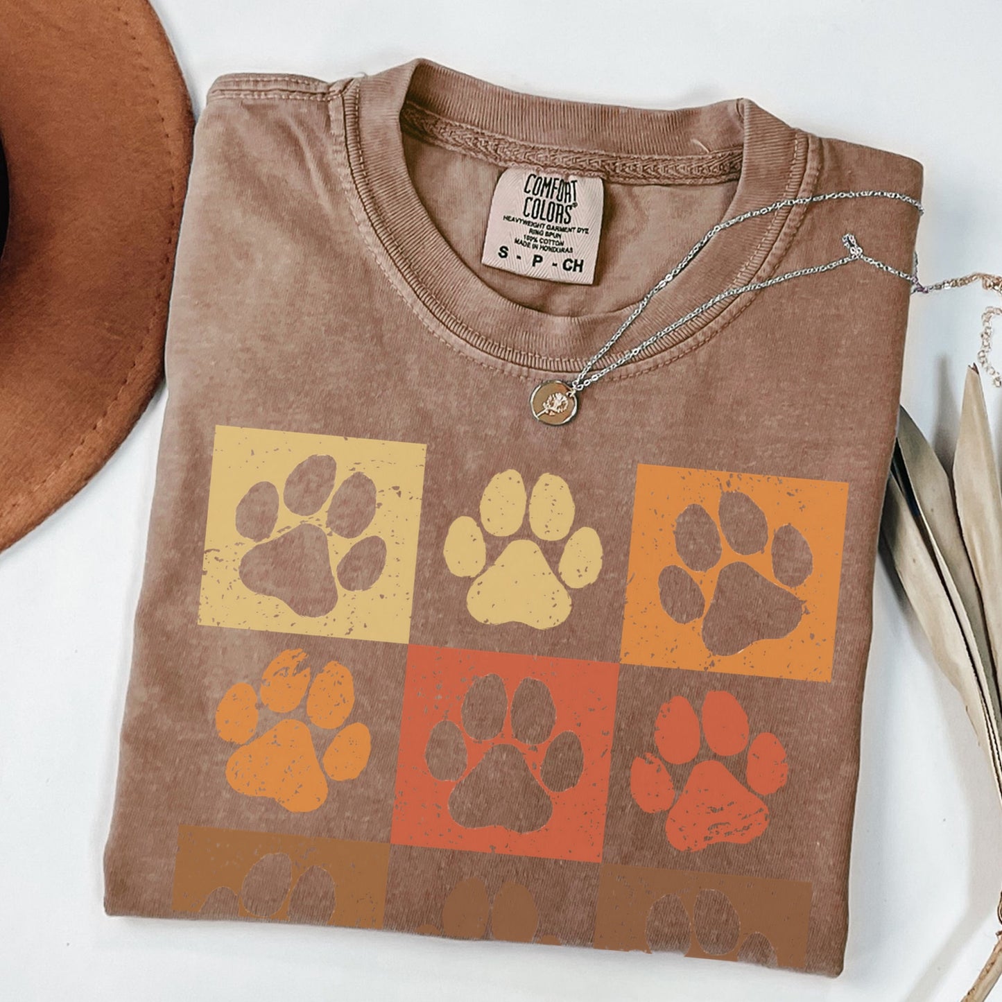 a t - shirt with a dog's paw prints on it