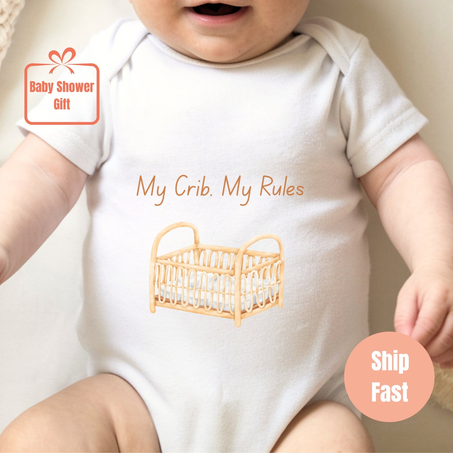 a baby wearing a white shirt with a baby crib on it