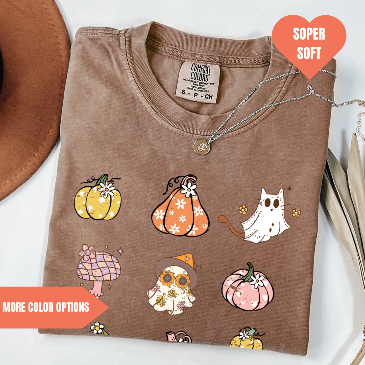 a brown t - shirt with a picture of pumpkins and owls on it