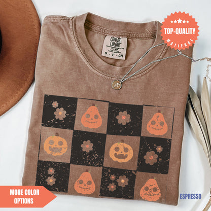 a t - shirt with a picture of pumpkins on it