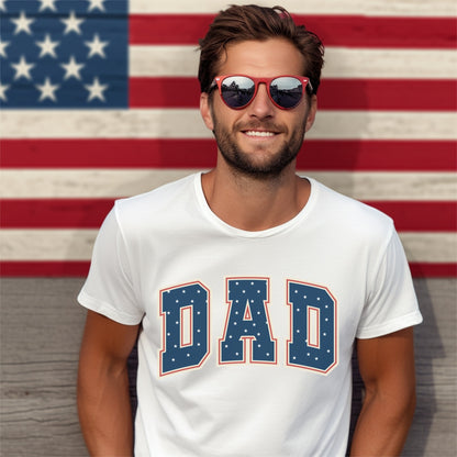 a man wearing sunglasses standing in front of an american flag