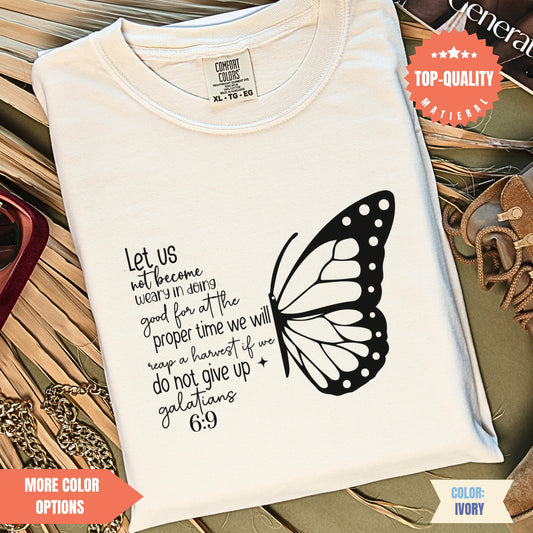 a white t - shirt with a butterfly on it