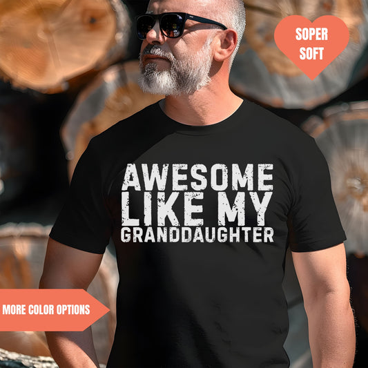 a man wearing a t - shirt that says awesome like my granddaughter