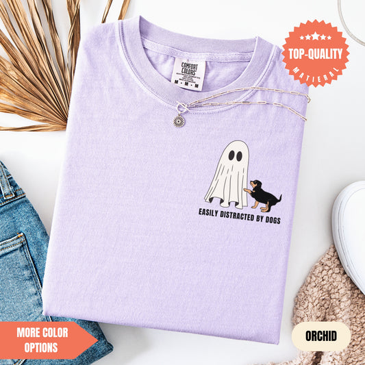 a purple t - shirt with a black dog on it