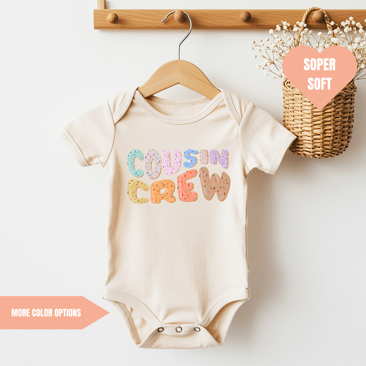 a baby bodysuit hanging on a clothes rack