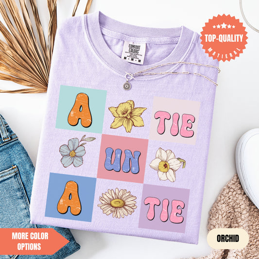 a t - shirt with the word'a'on it next to a pair