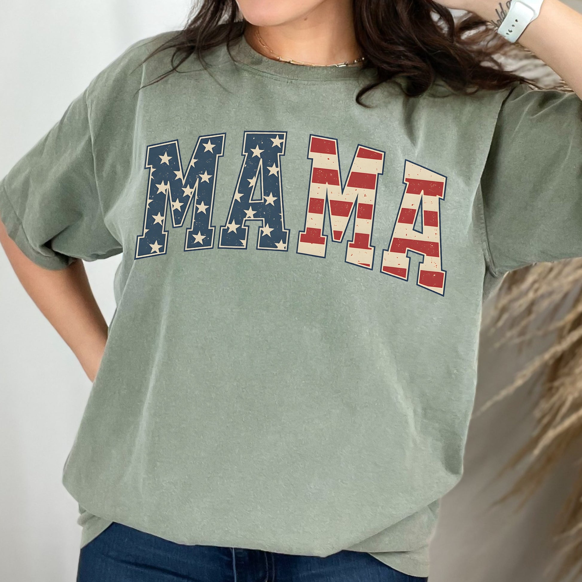 a woman wearing a green shirt with the word am on it