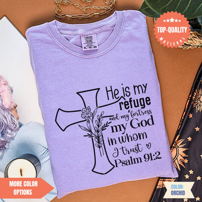 a purple t - shirt with a cross on it