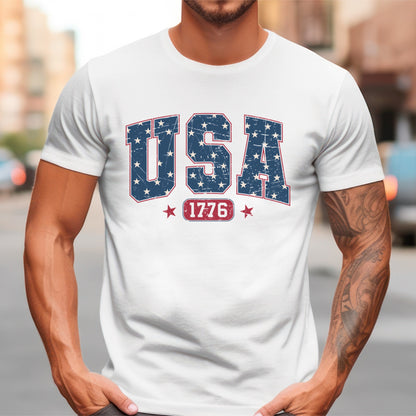 a man wearing a white usa t - shirt with red, white, and blue