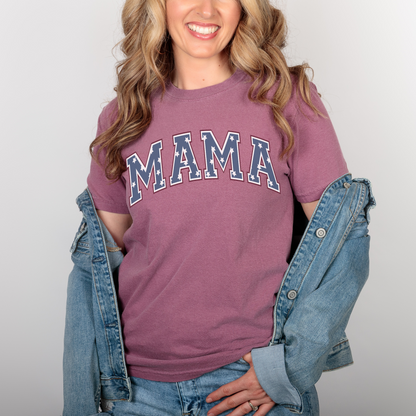 a woman in a maroon shirt and jean jacket