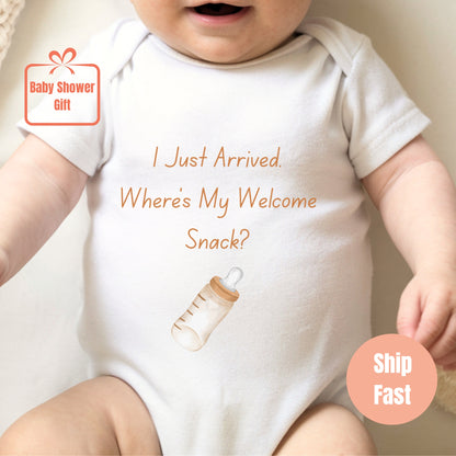 a baby wearing a white bodysuit with a message on it