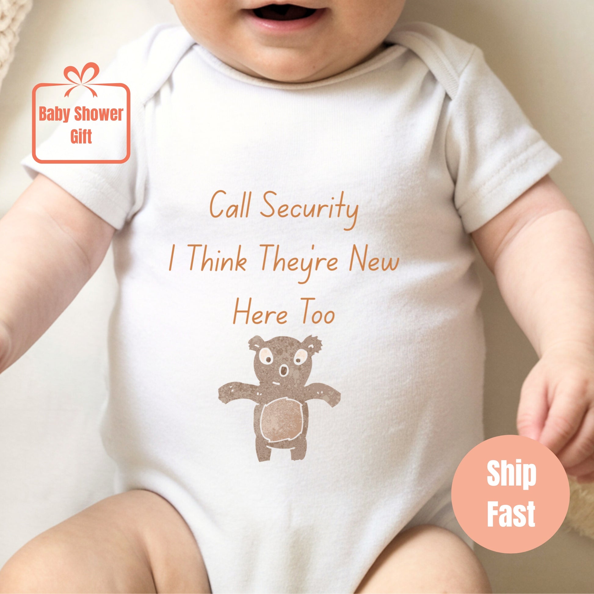 a baby wearing a bodysuit with a teddy bear on it