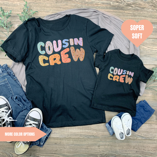 a couple of shirts sitting on top of a wooden floor