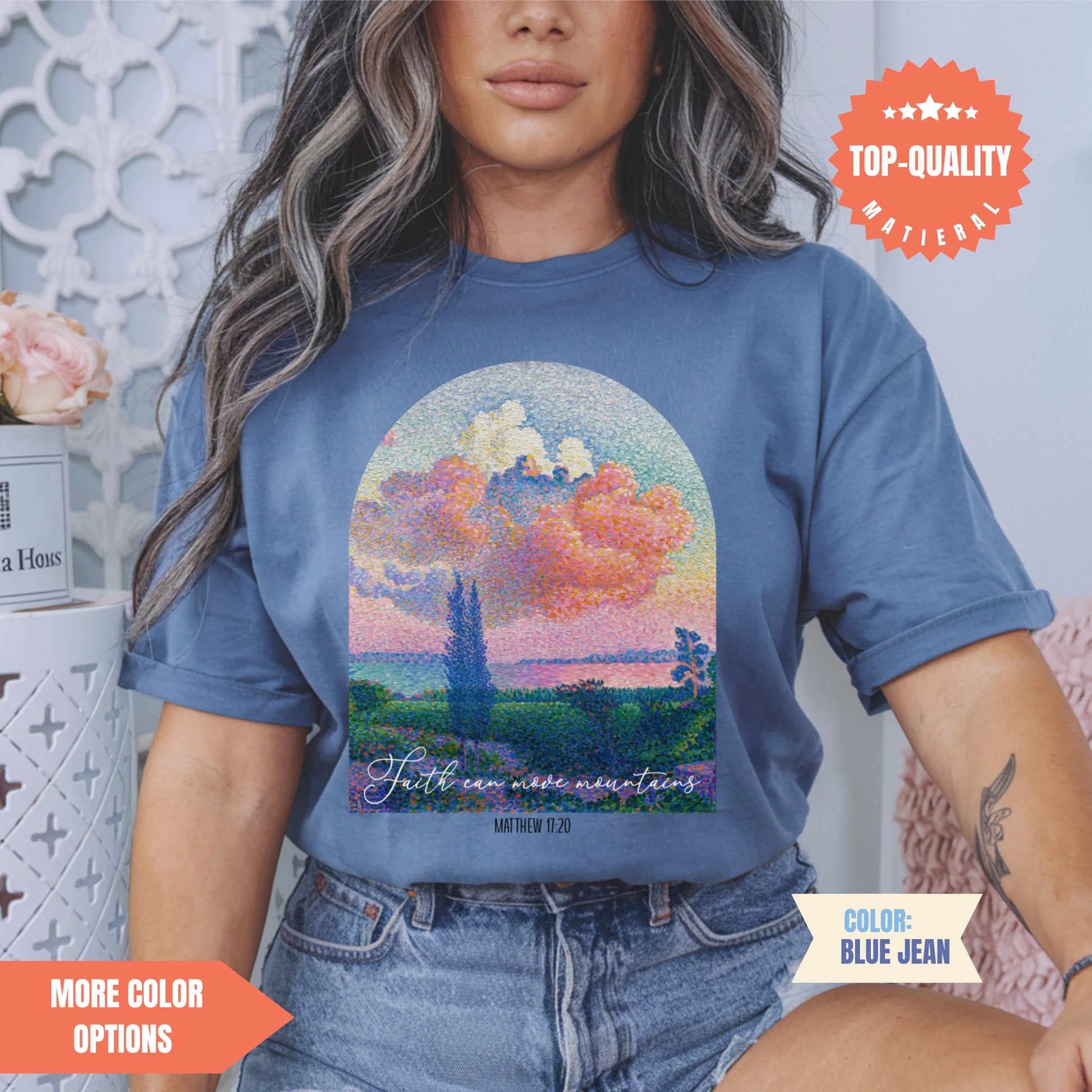 a woman wearing a t - shirt with a painting on it