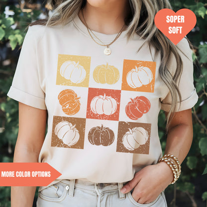 a woman wearing a t - shirt with pumpkins on it