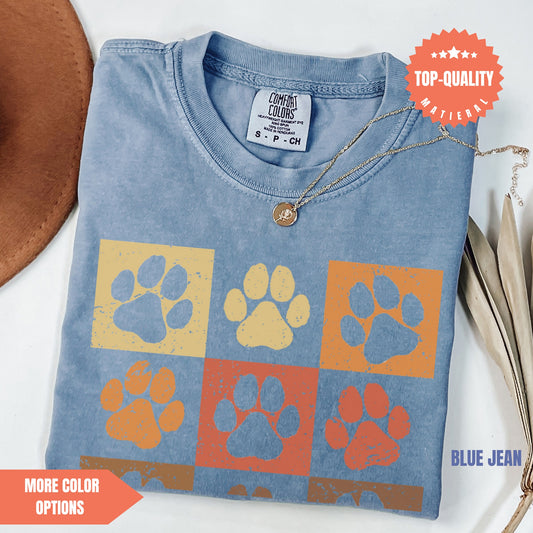 a t - shirt with a dog's paw prints on it