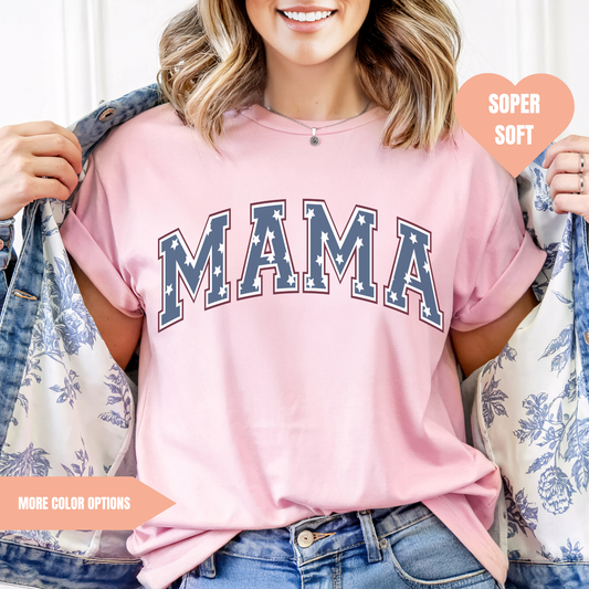 a woman wearing a pink shirt with the word mama printed on it